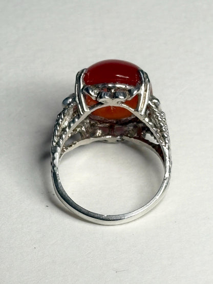 Sterling silver ring with a bold, oval carnelian cabochon.