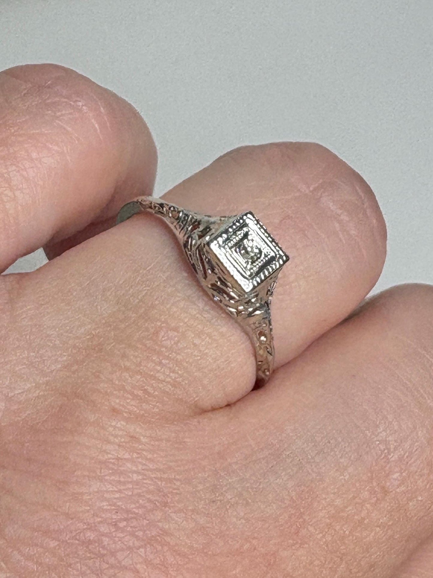 Art Deco 18k gold filigree ring with an old mine cut diamond.