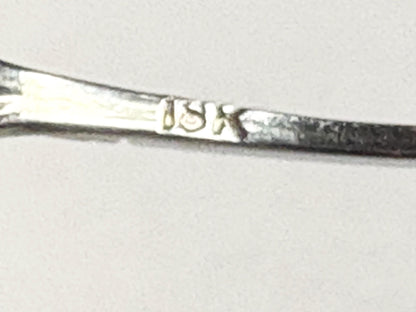 Solid 18k gold band with filigree detail and a small diamond.