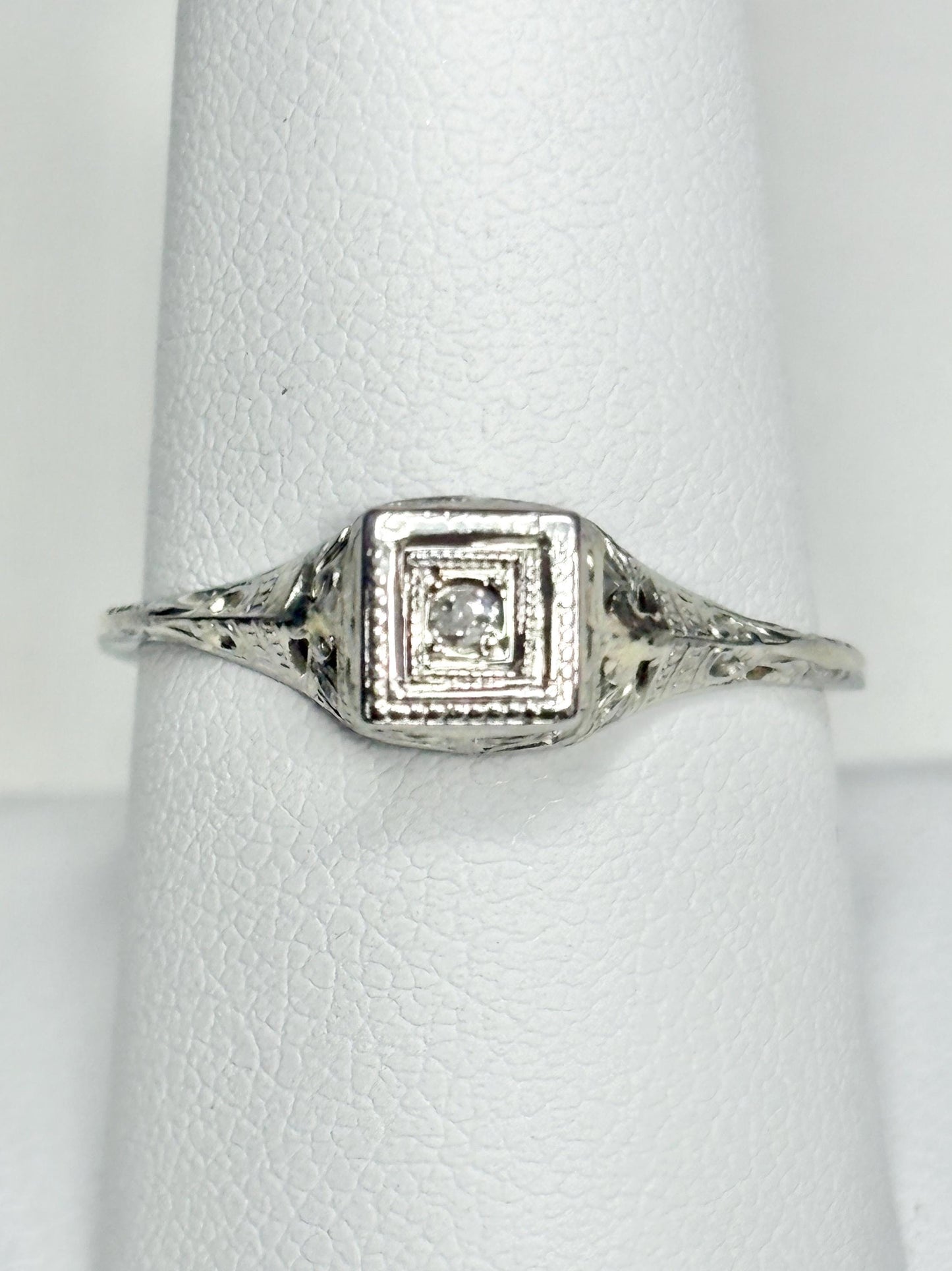 Antique 18k gold Art Deco ring with a small old mine cut diamond.