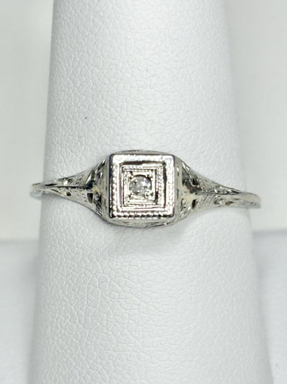 Antique 18k gold Art Deco ring with a small old mine cut diamond.