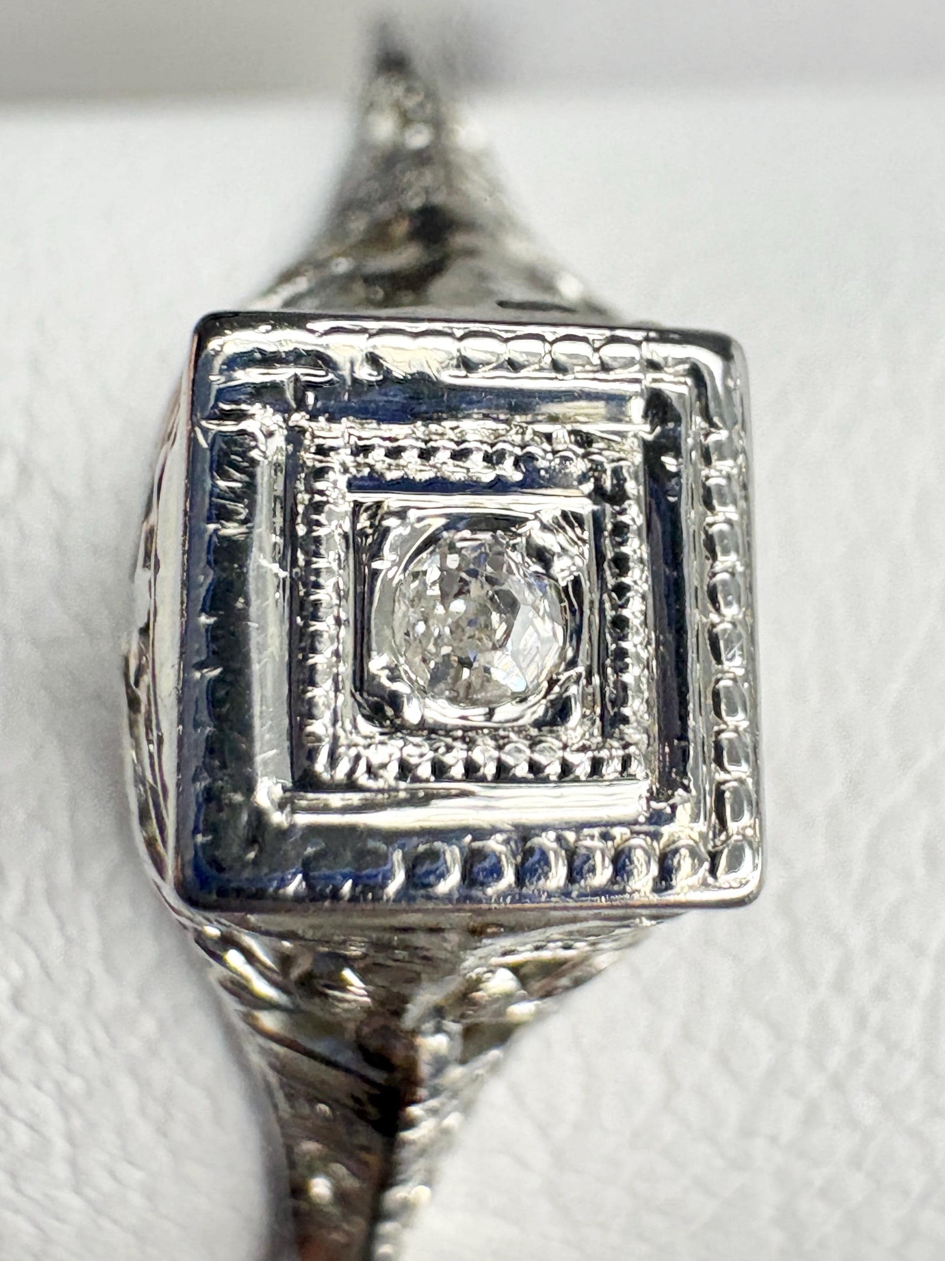 Antique Art Deco 18k gold ring with a small old mine cut diamond.