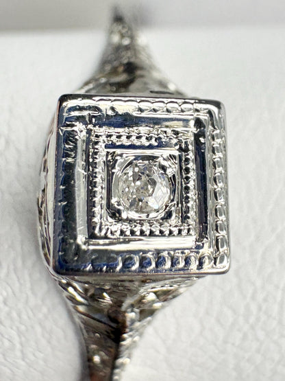 Antique Art Deco 18k gold ring with a small old mine cut diamond.