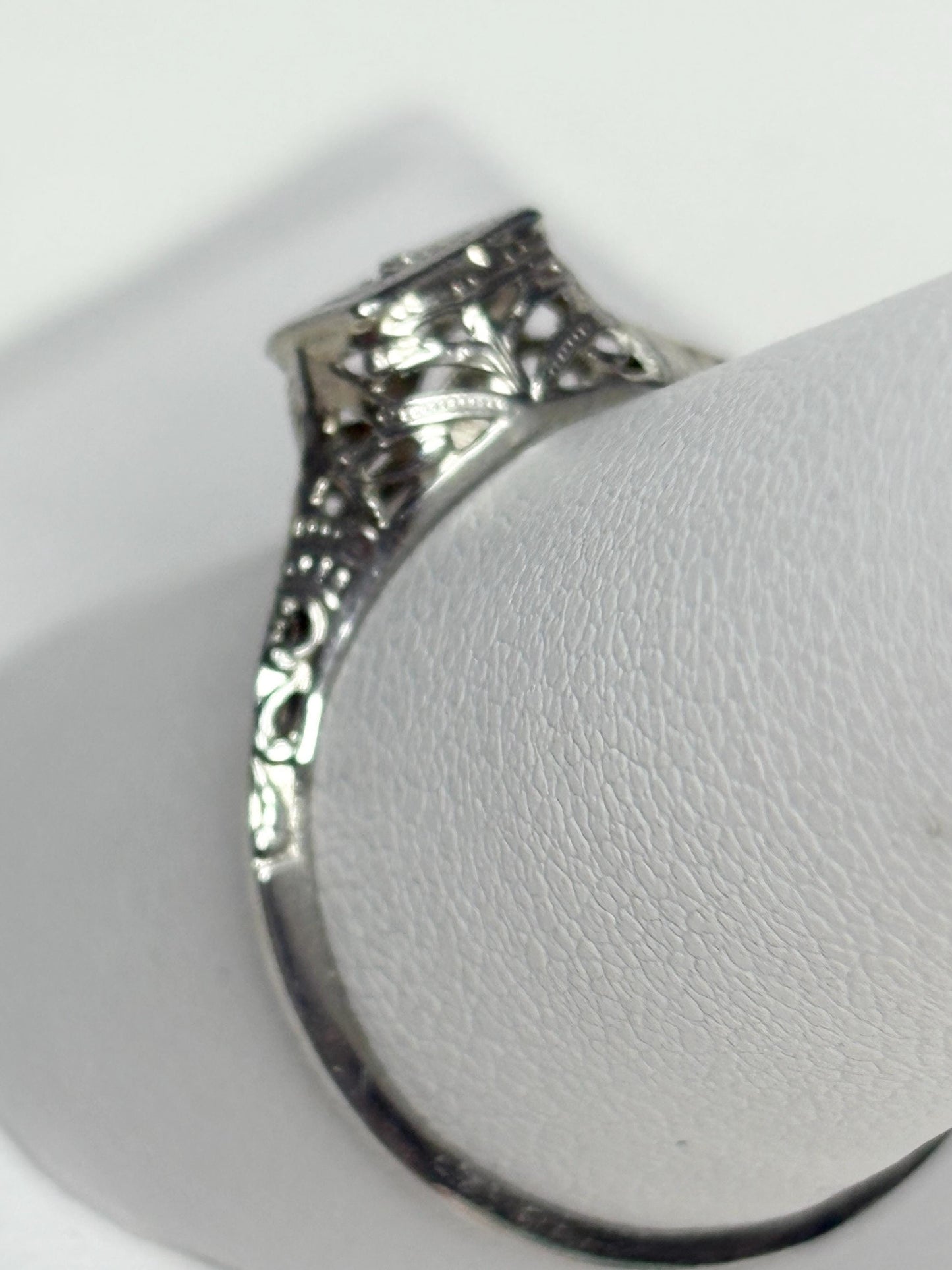 Art Deco 18k gold filigree ring with a diamond chip.