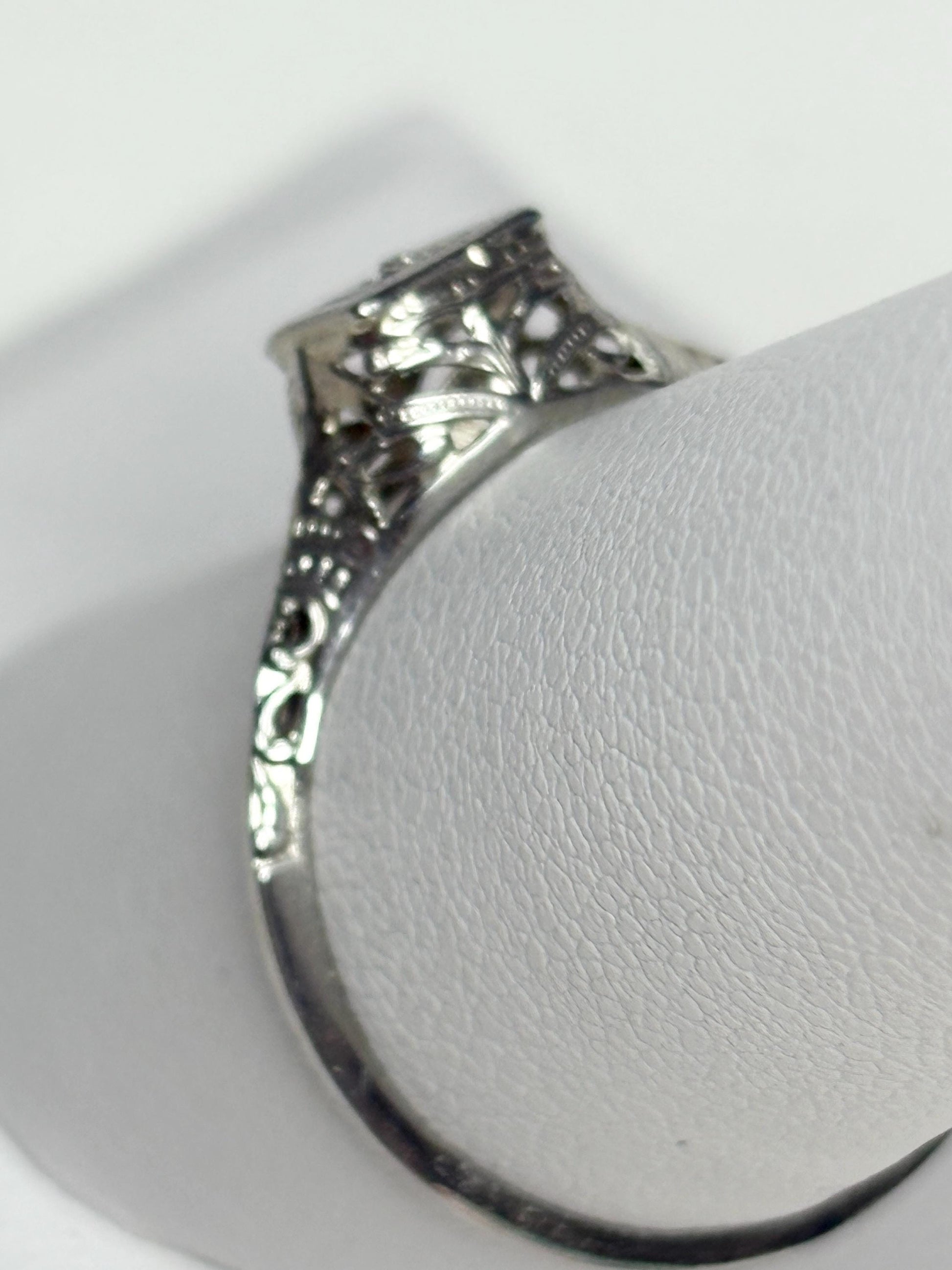 Art Deco 18k gold filigree ring with a diamond chip.