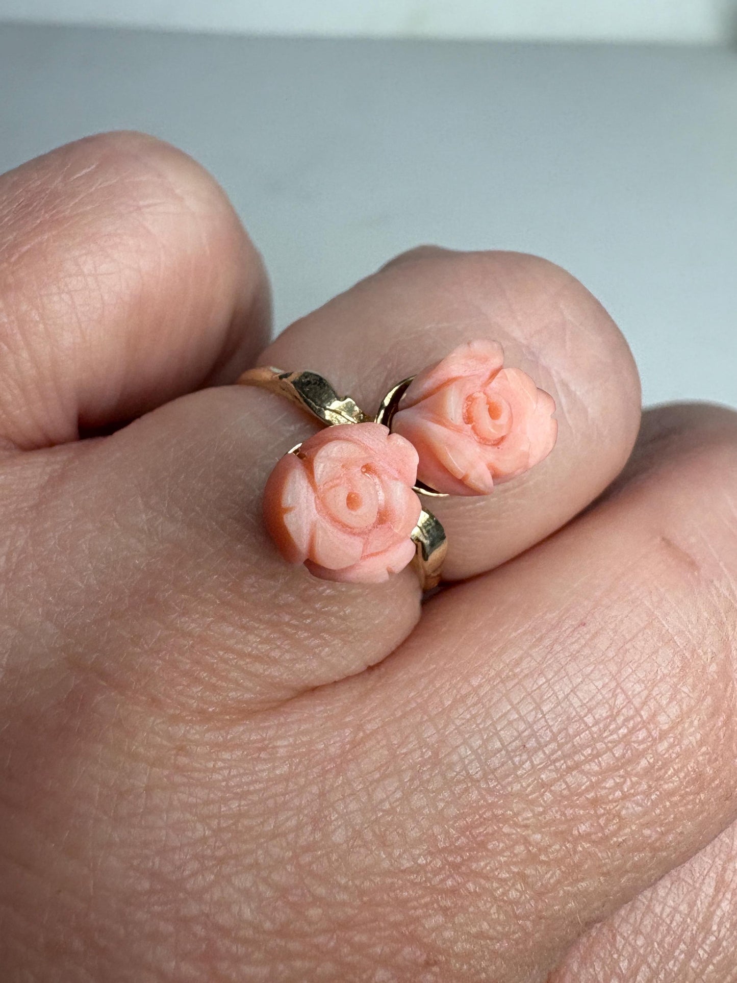 10k gold ring with two carved angel skin coral rose buds.