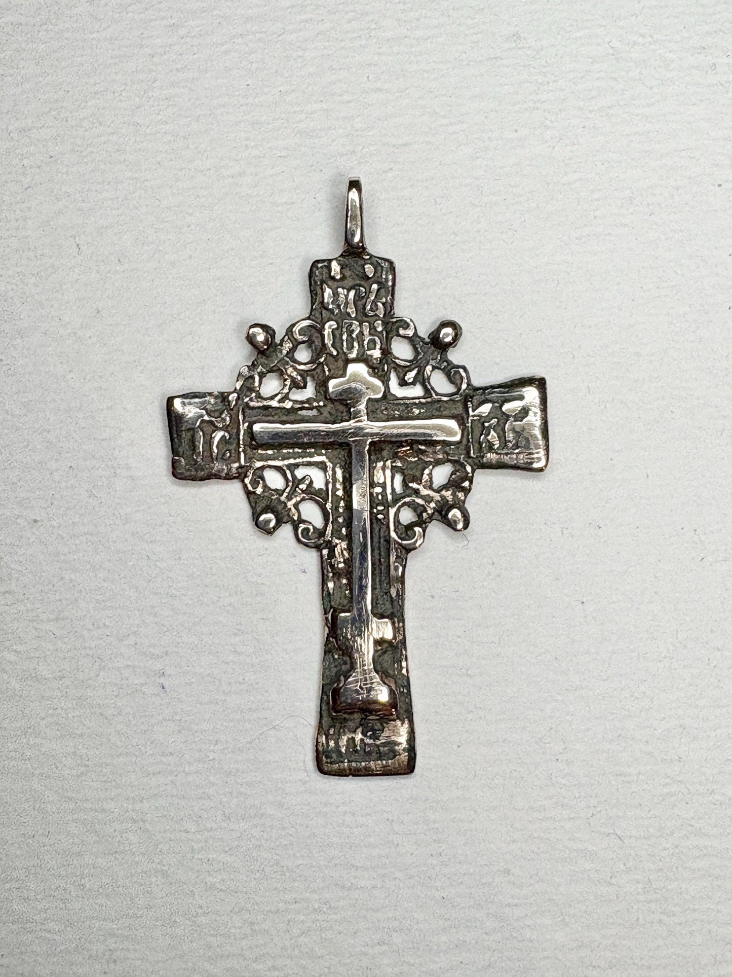 Large ancient Russian Orthodox bronze cross pendant with intricate details.