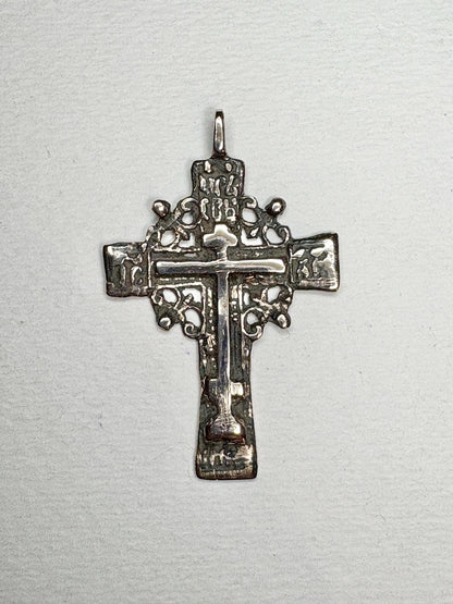 Large ancient Russian Orthodox bronze cross pendant with intricate details.