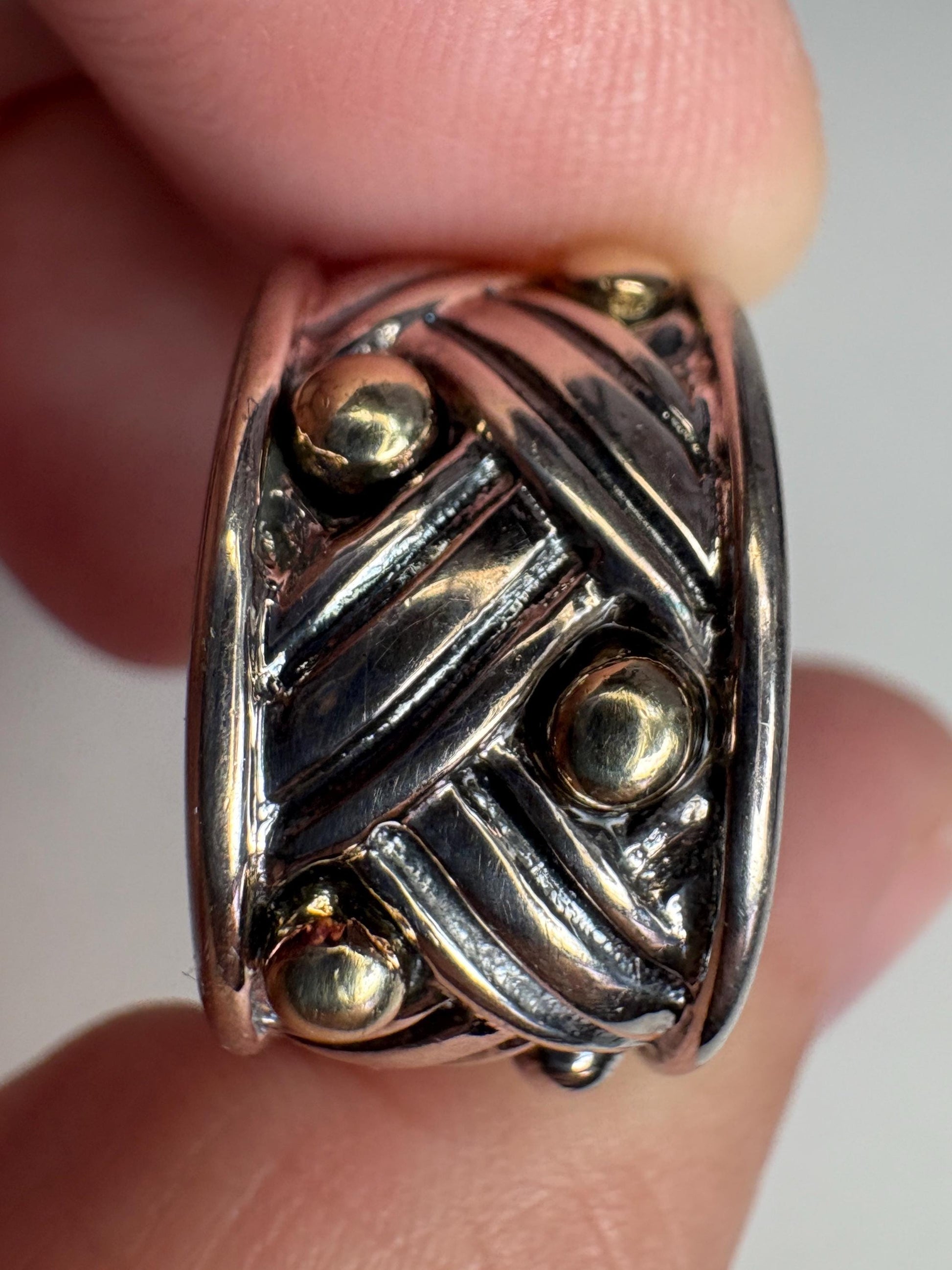 Ann King wide woven hoop earrings in sterling silver with 18k gold dots.