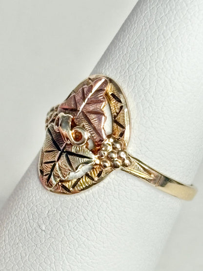 Black Hills Gold ring with 12k leaves on a 10k band.