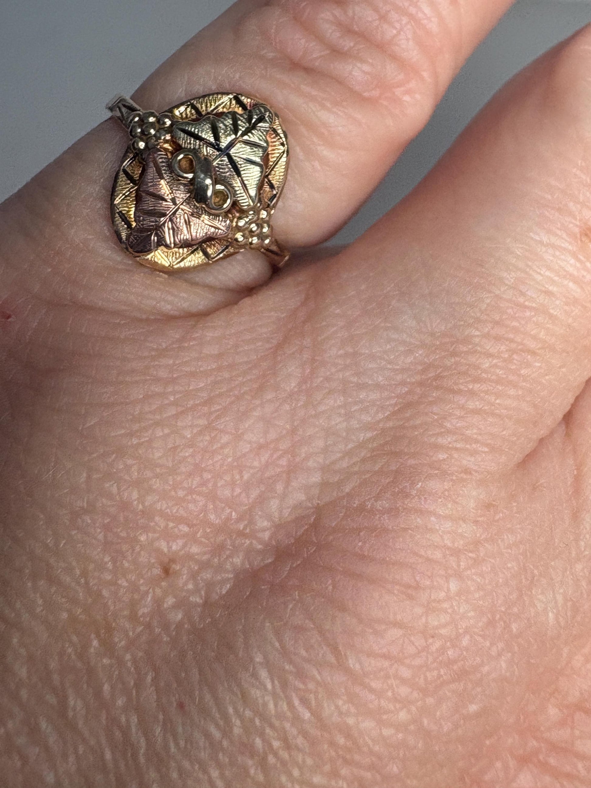 Black Hills Gold ring with two 12k gold leaves on a 10k gold band.