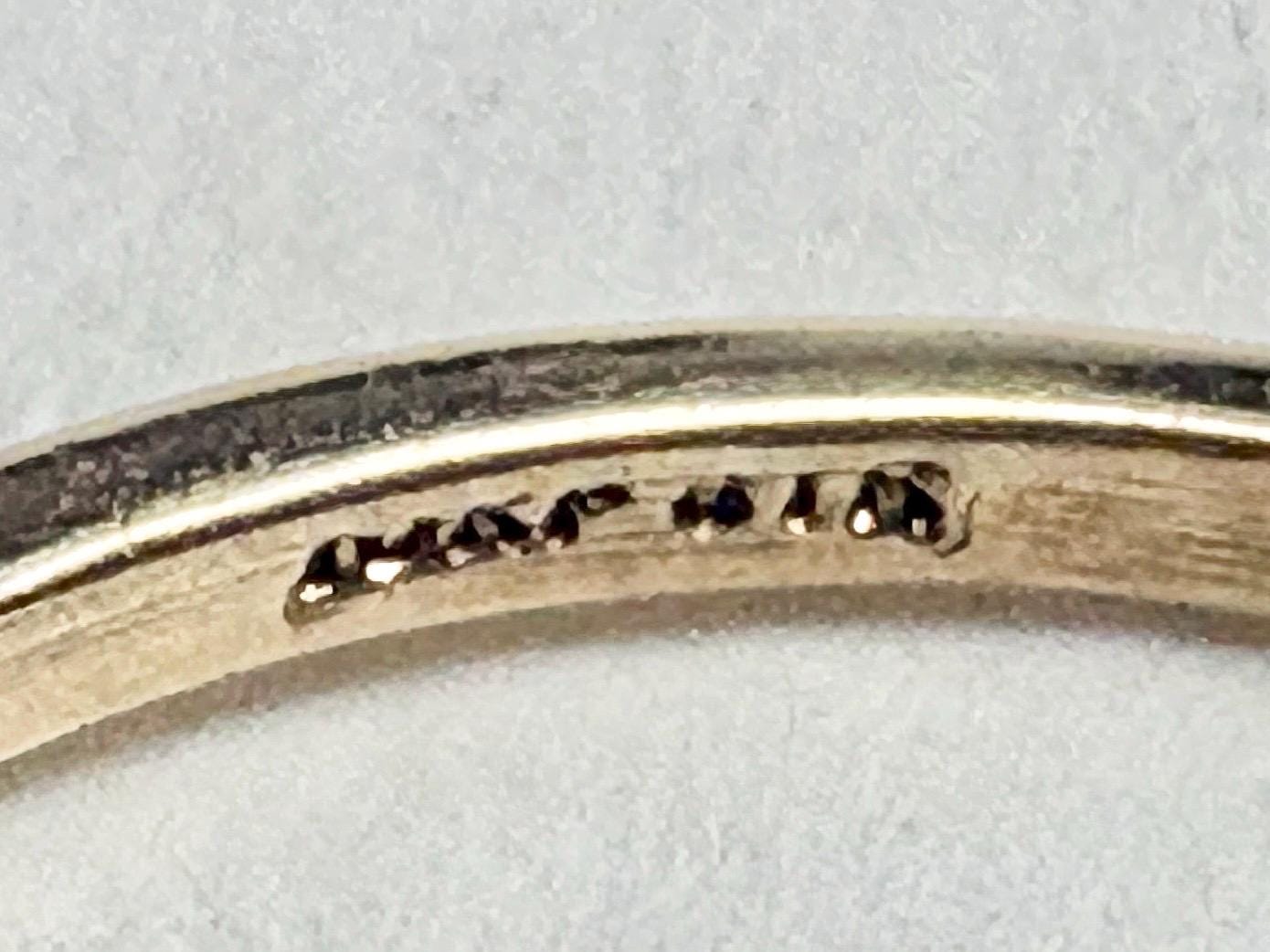 Ring with hallmarks stamped on the band.
