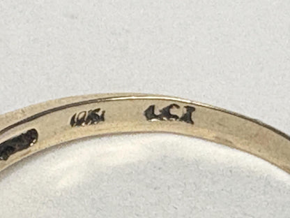 Ring with 10k gold hallmark and inscription.
