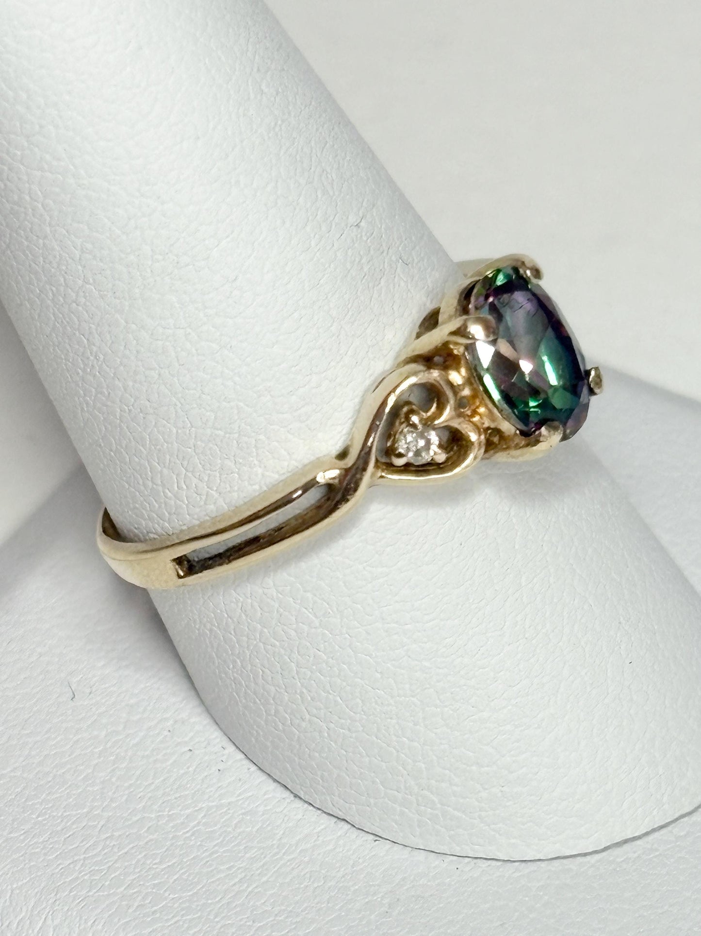 10k yellow gold ring with mystic topaz and two diamonds.