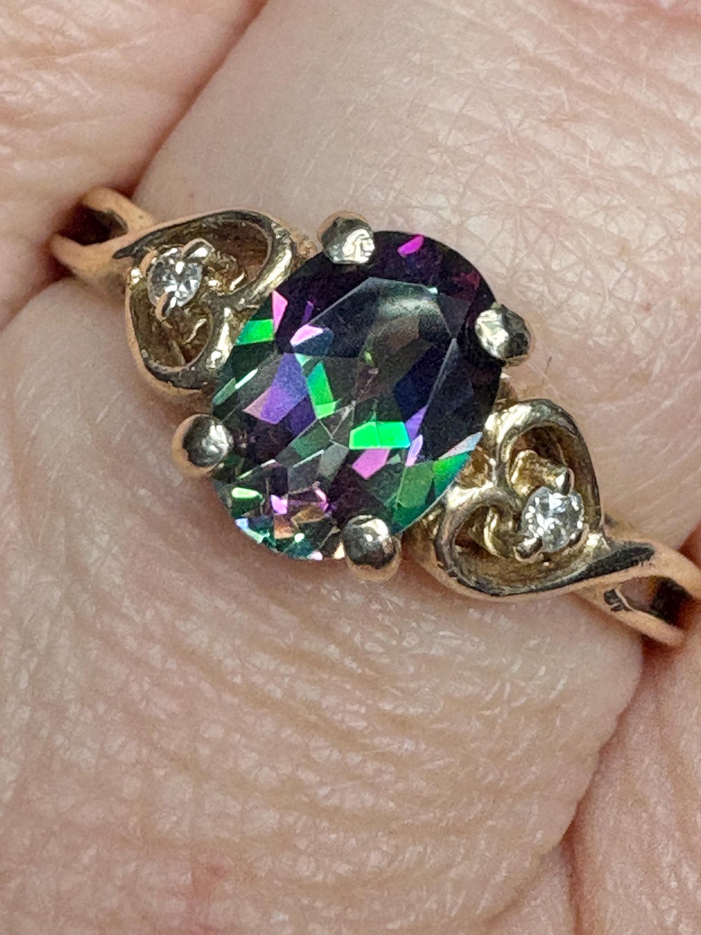 Oval mystic topaz and diamond heart ring in 10k yellow gold.