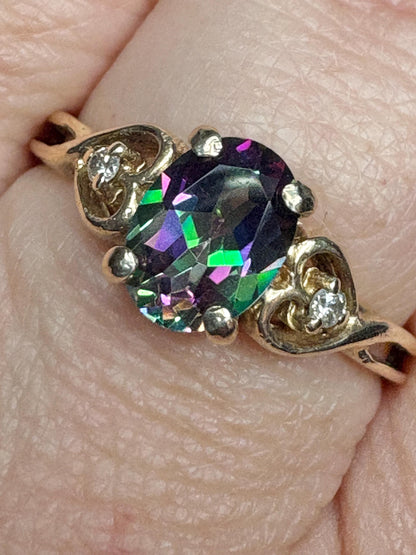 Oval mystic topaz and diamond heart ring in 10k yellow gold.
