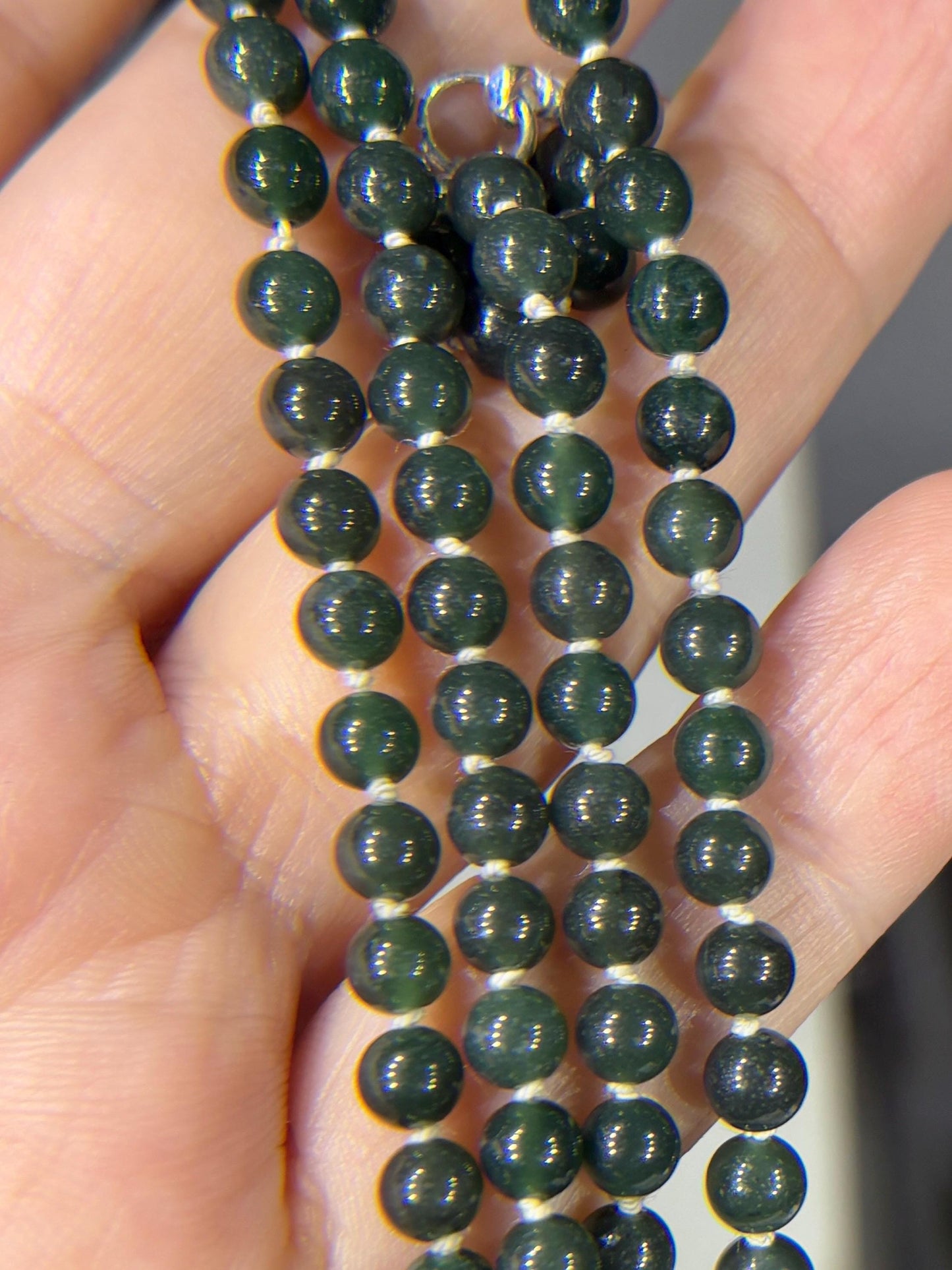 Teal Guatemalan jadeite jade beads with a sterling silver clasp.