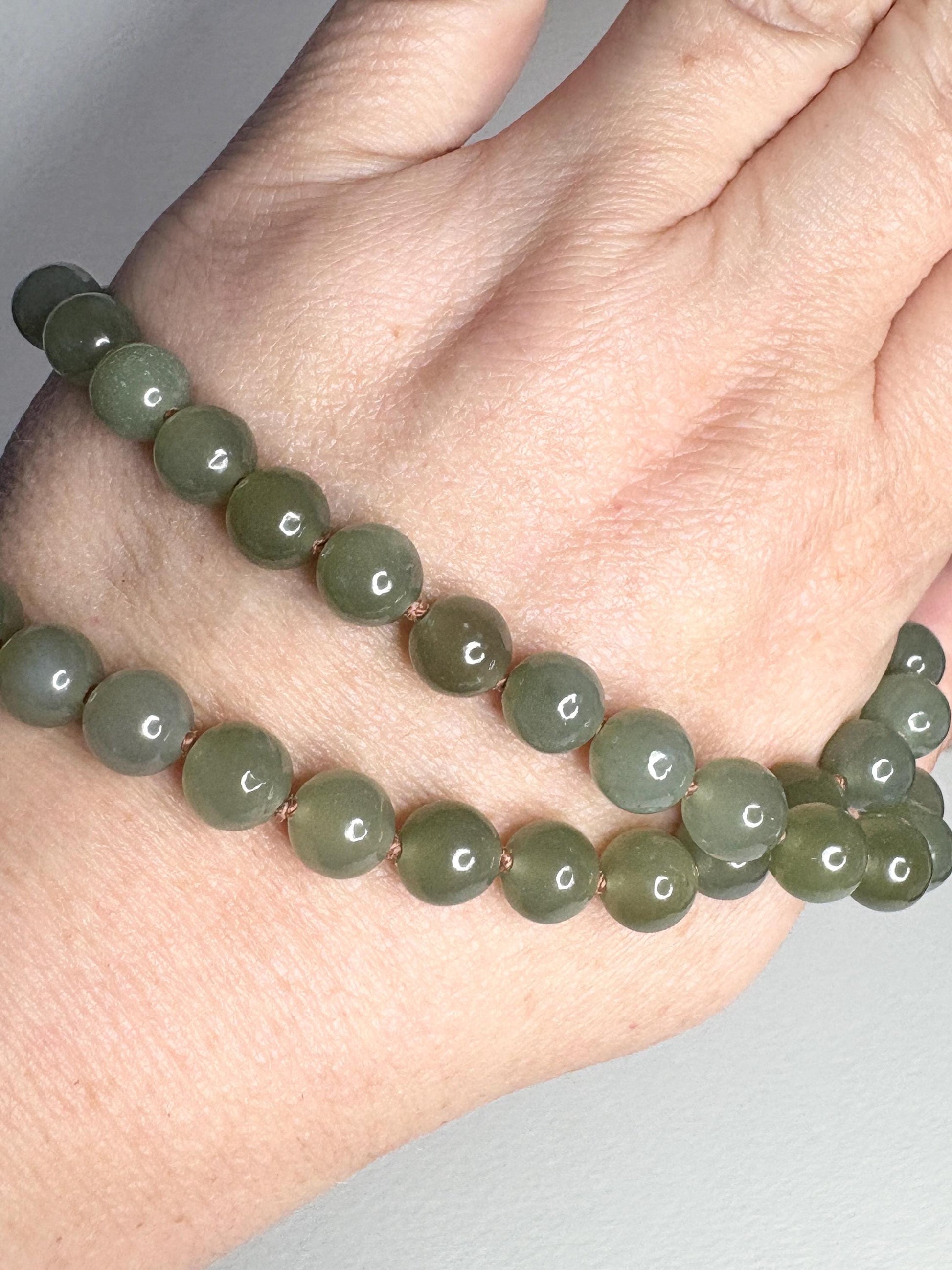 Nephrite Hetian Jade knotted bead bracelet with sterling silver toggle.