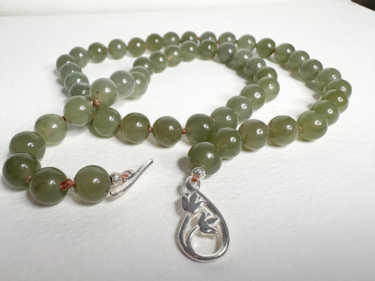 Nephrite Hetian Jade knotted bead necklace with sterling silver toggle clasp.