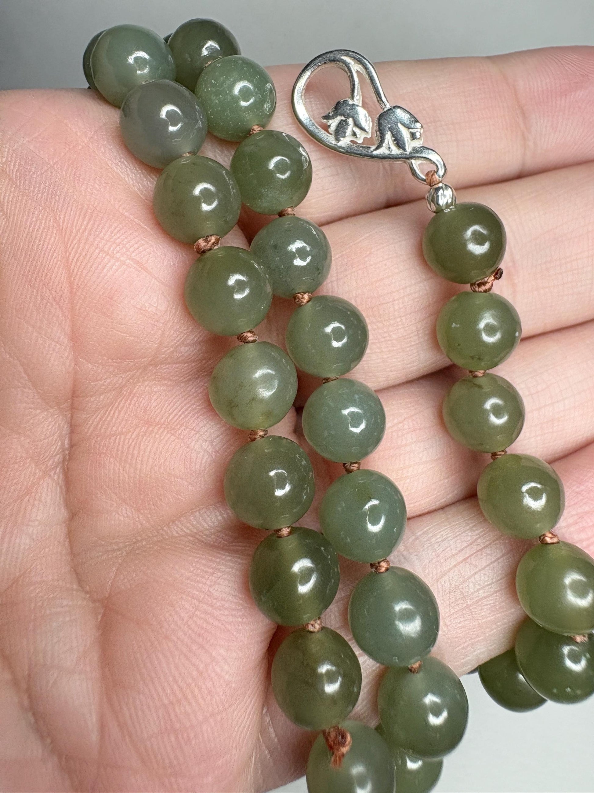 Nephrite Hetian Jade knotted bead bracelet with sterling silver toggle clasp.