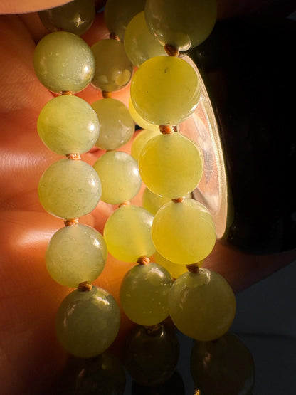 Nephrite Hetian Jade knotted bead bracelet with sterling silver toggle.