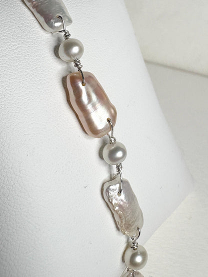 Sterling silver bracelet with white and peach biwa freshwater pearls.
