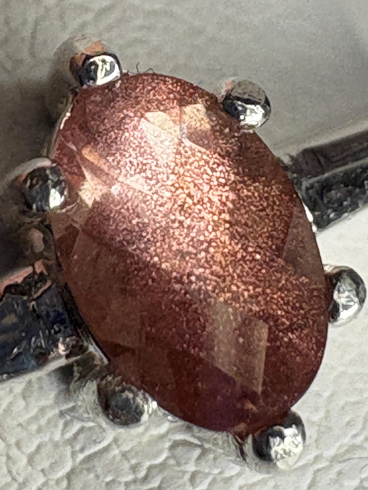 Oval Oregon Sunstone solitaire ring in sterling silver.