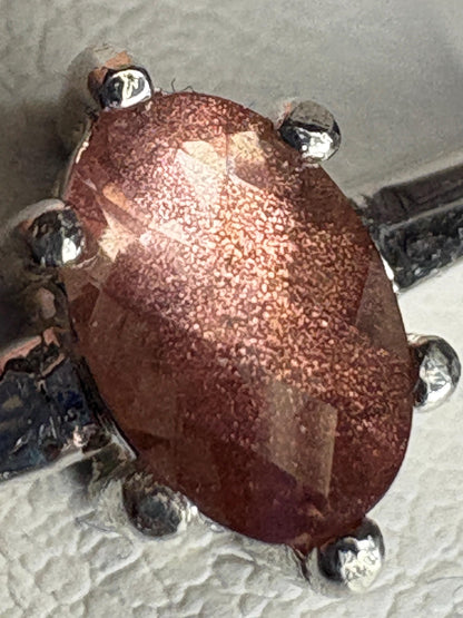 Oval Oregon Sunstone solitaire ring in sterling silver.