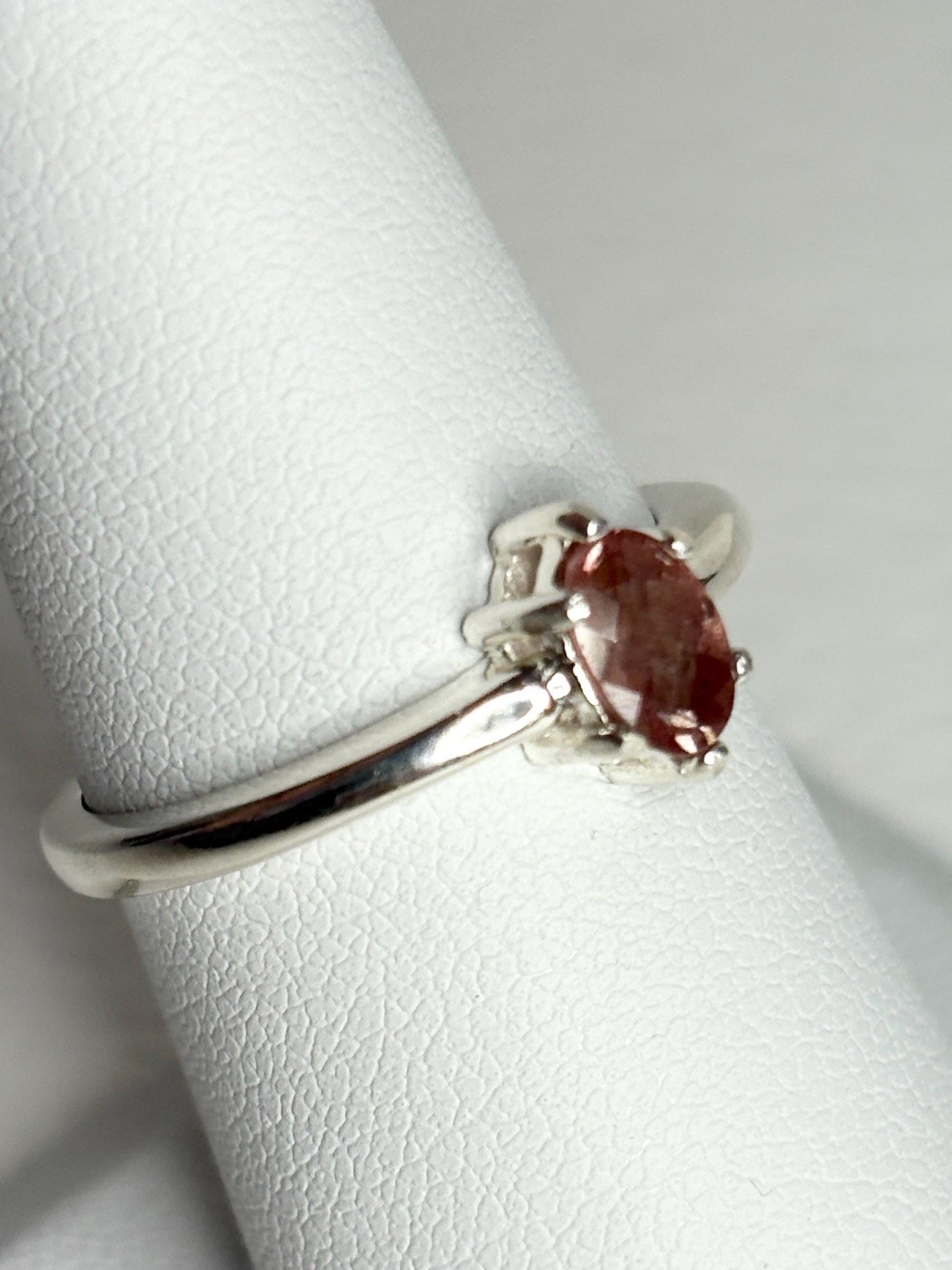Sterling silver ring with an oval, peach Oregon sunstone.