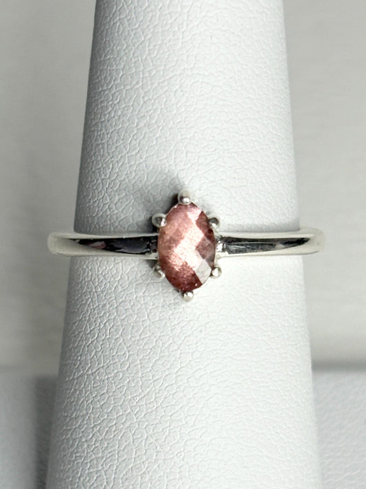 Sterling silver ring with a faceted oval Oregon sunstone.
