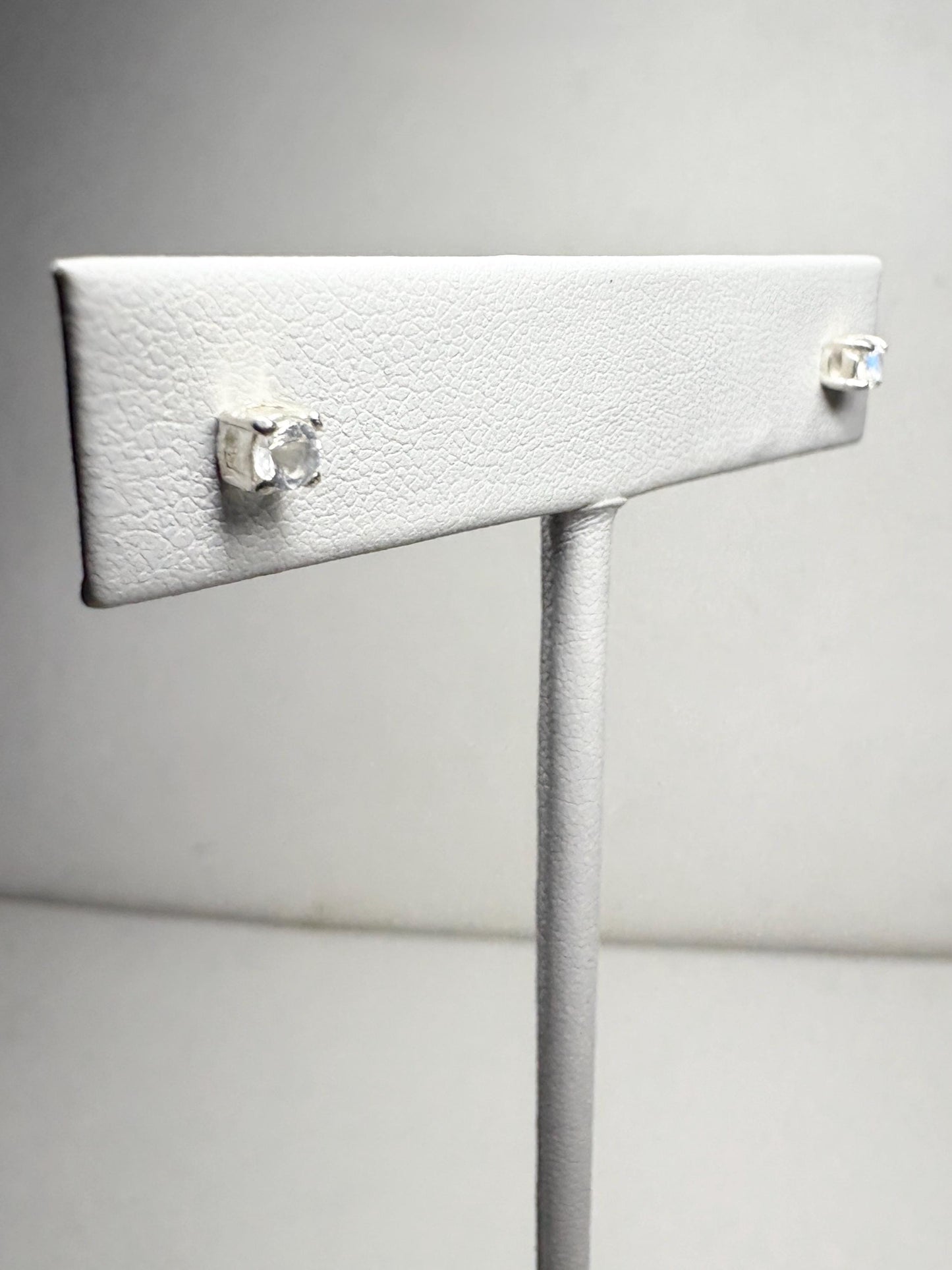 Sterling silver stud earrings with 3mm blue sheen moonstone gems.