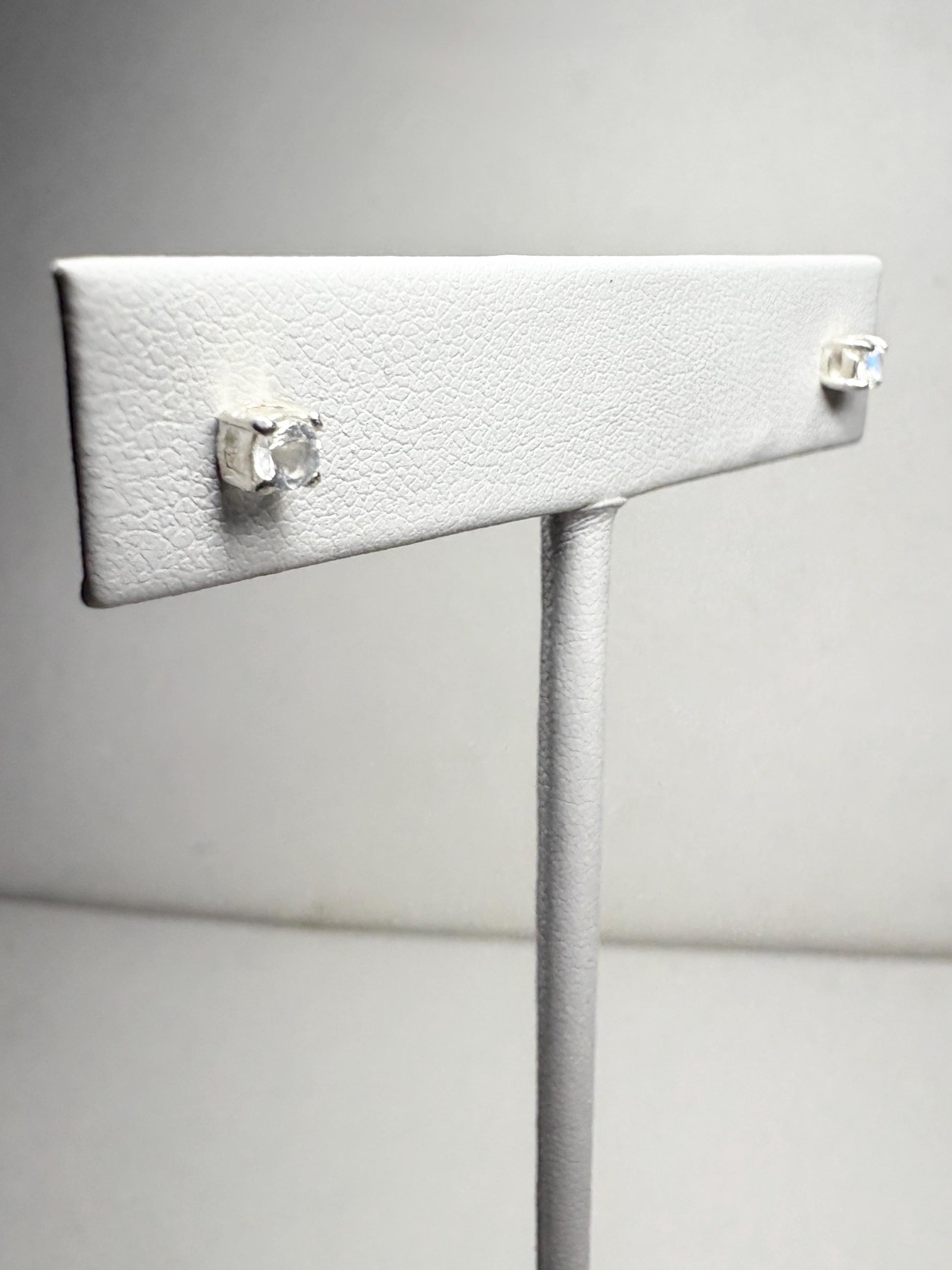 Sterling silver stud earrings with 3mm blue sheen moonstone gems.