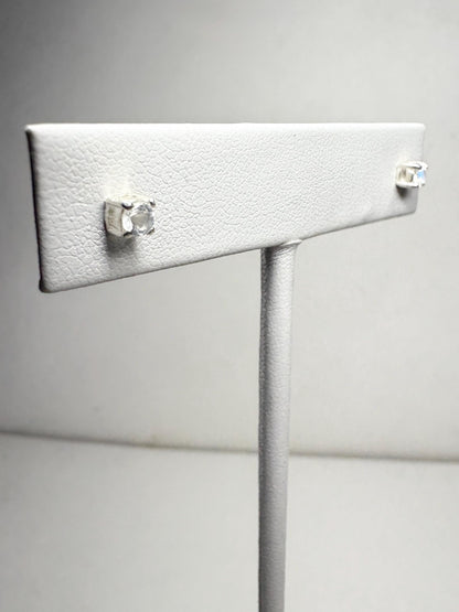 Sterling silver stud earrings with 3mm blue sheen moonstone gems.