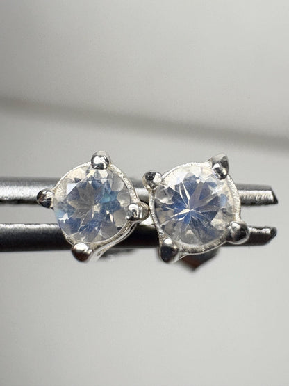 Sterling silver stud earrings featuring 3mm round blue sheen moonstones.
