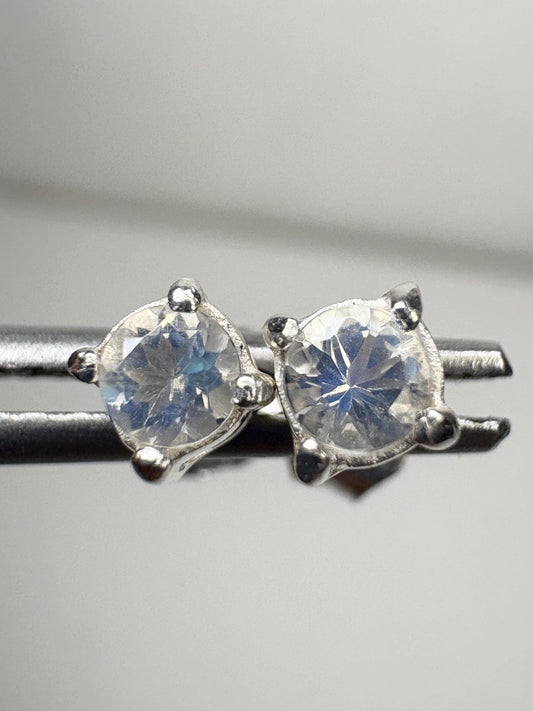 Sterling silver stud earrings featuring 3mm round blue sheen moonstones.