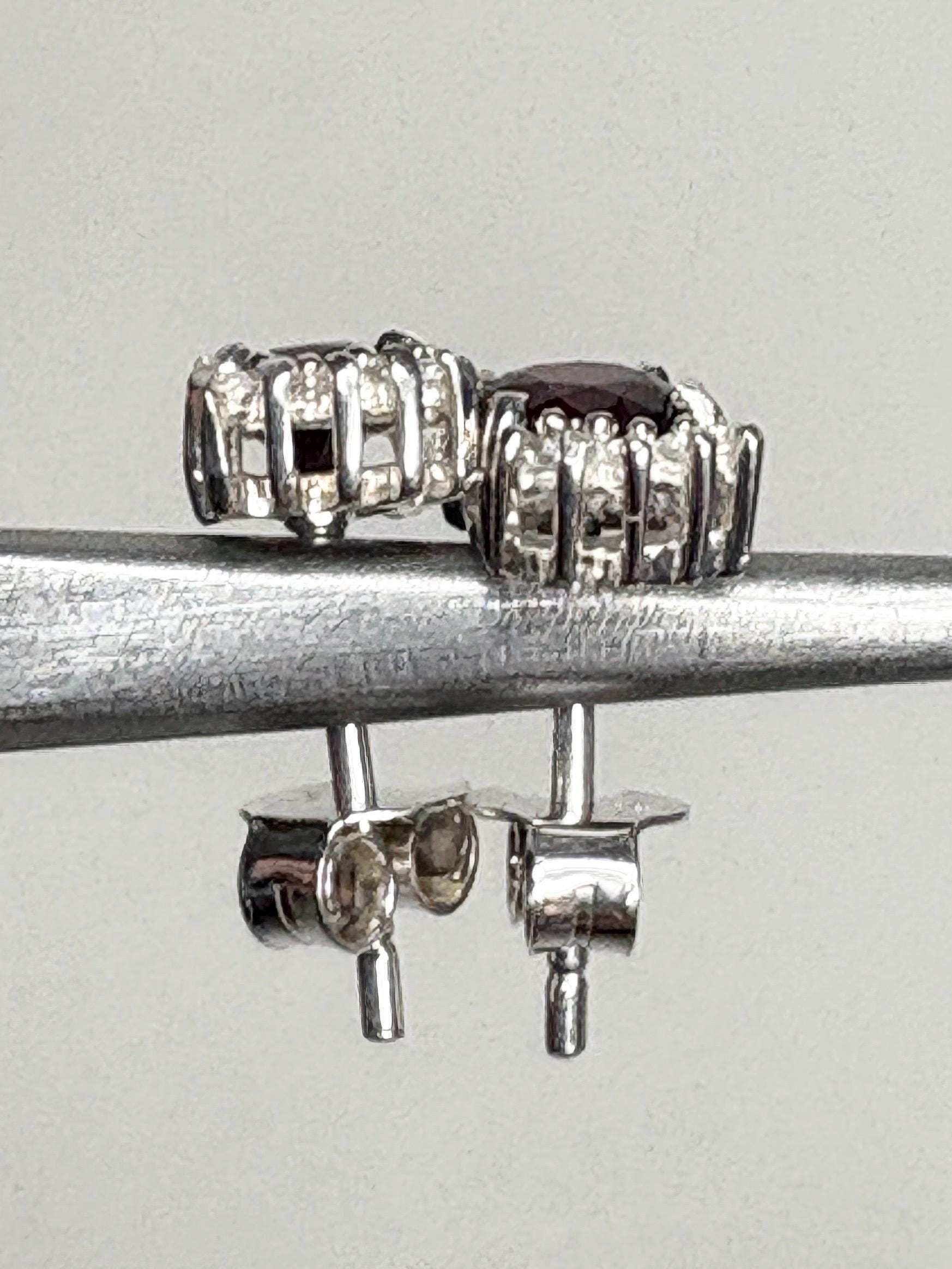 Sterling silver stud earrings with oval Arizona anthill garnets and round zircons.