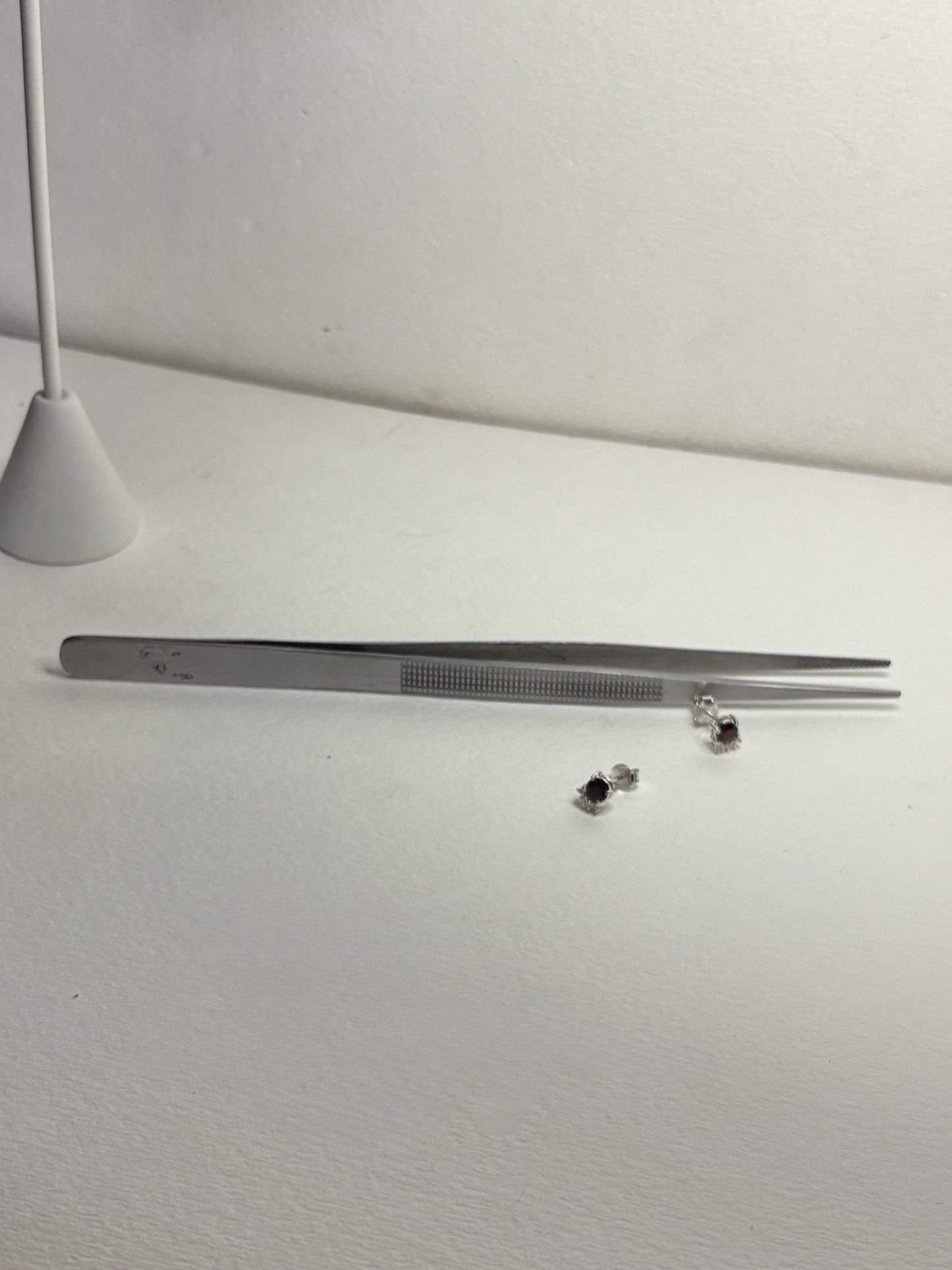 Sterling silver stud earrings with Arizona anthill garnets and zircons.