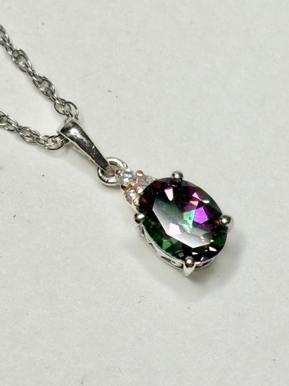 Sterling silver pendant necklace with oval mystic topaz and lab-grown diamonds.
