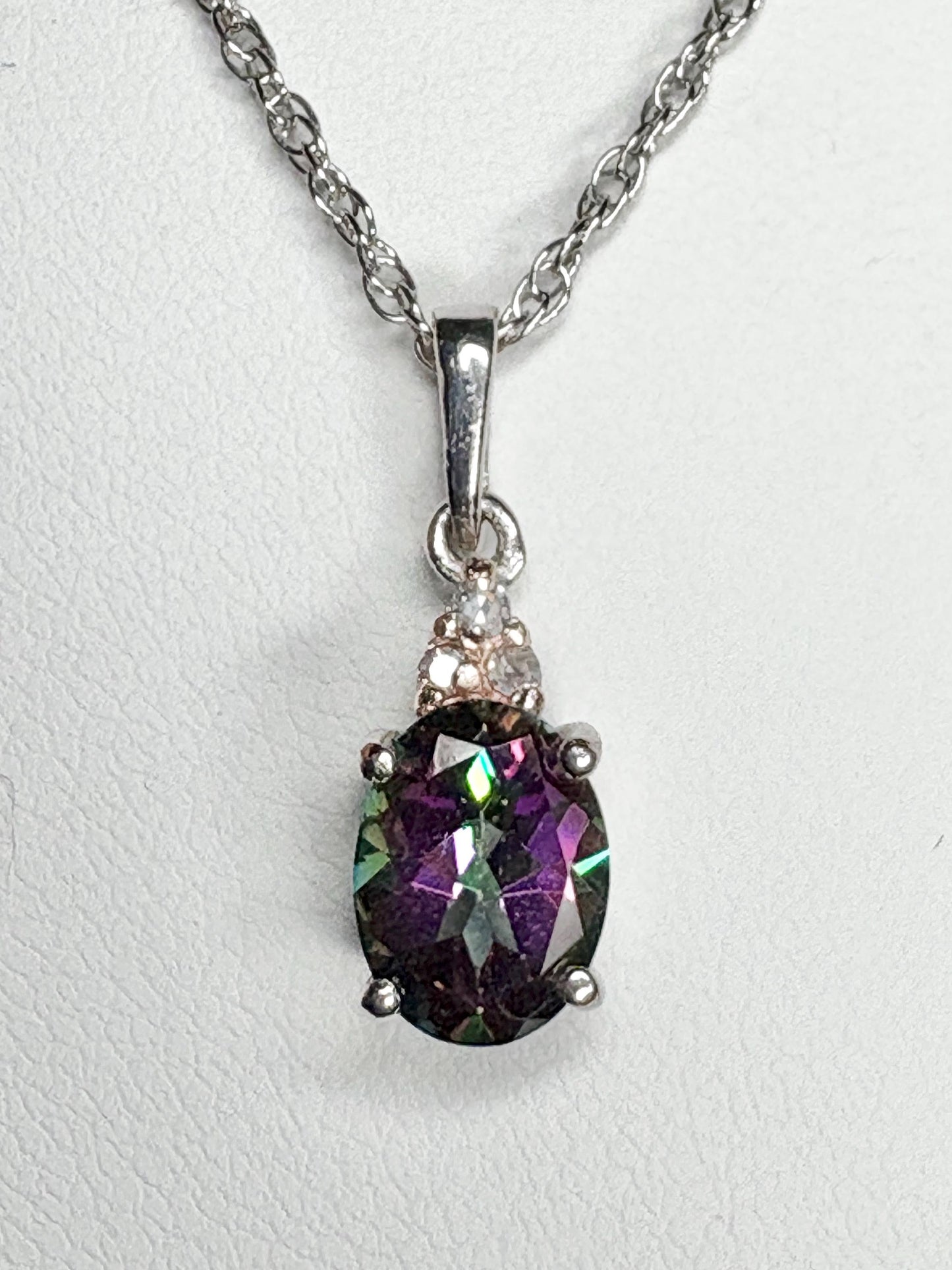 Sterling silver pendant necklace with oval mystic topaz and lab-grown diamonds.