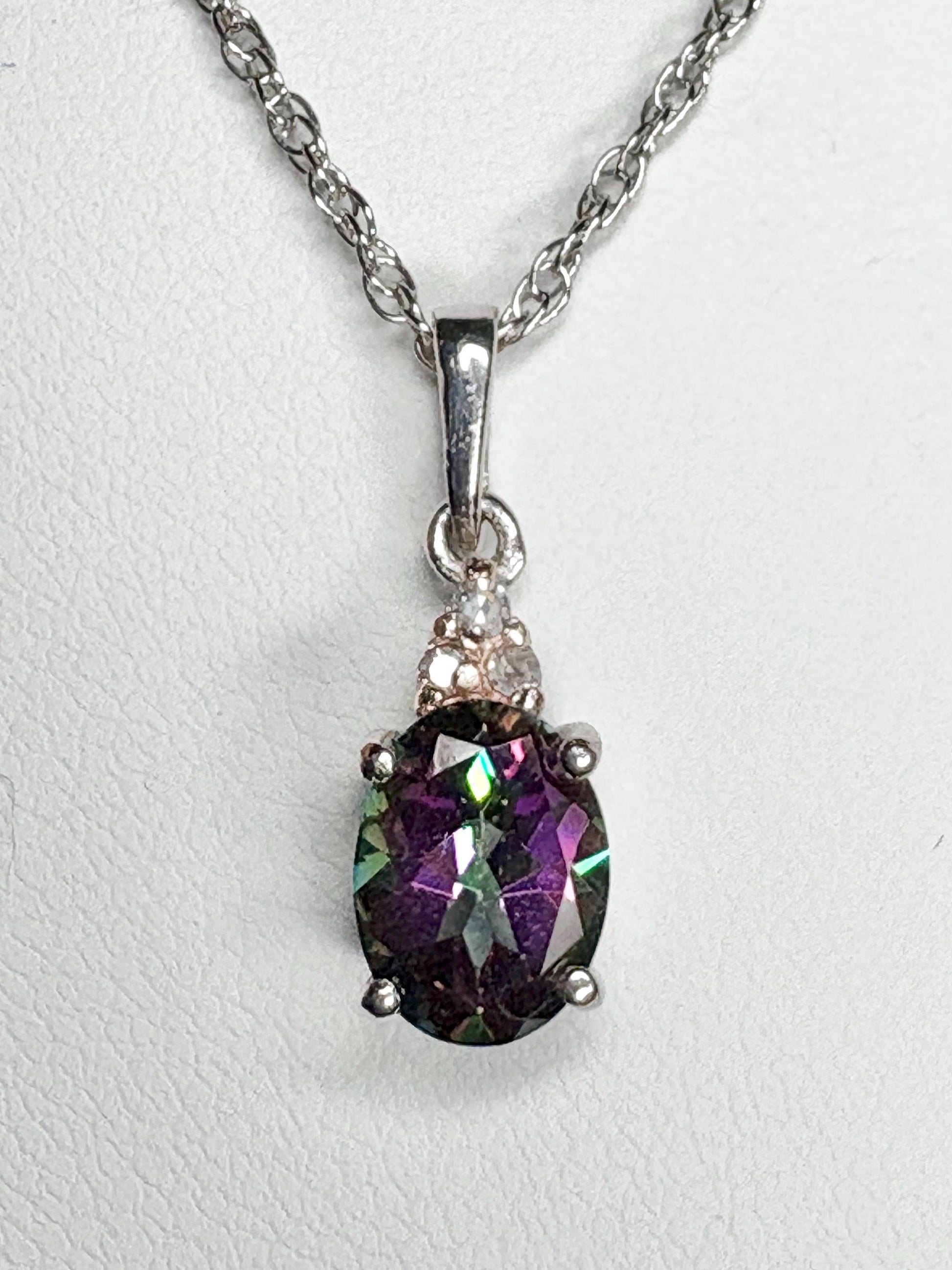 Sterling silver pendant necklace with oval mystic topaz and lab-grown diamonds.