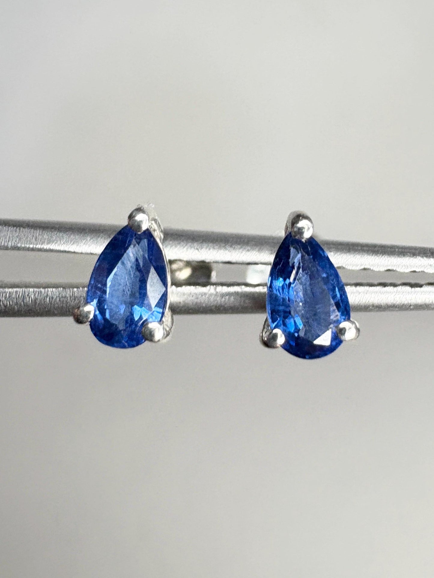 Sterling silver stud earrings with pear-shaped kyanite gemstones.