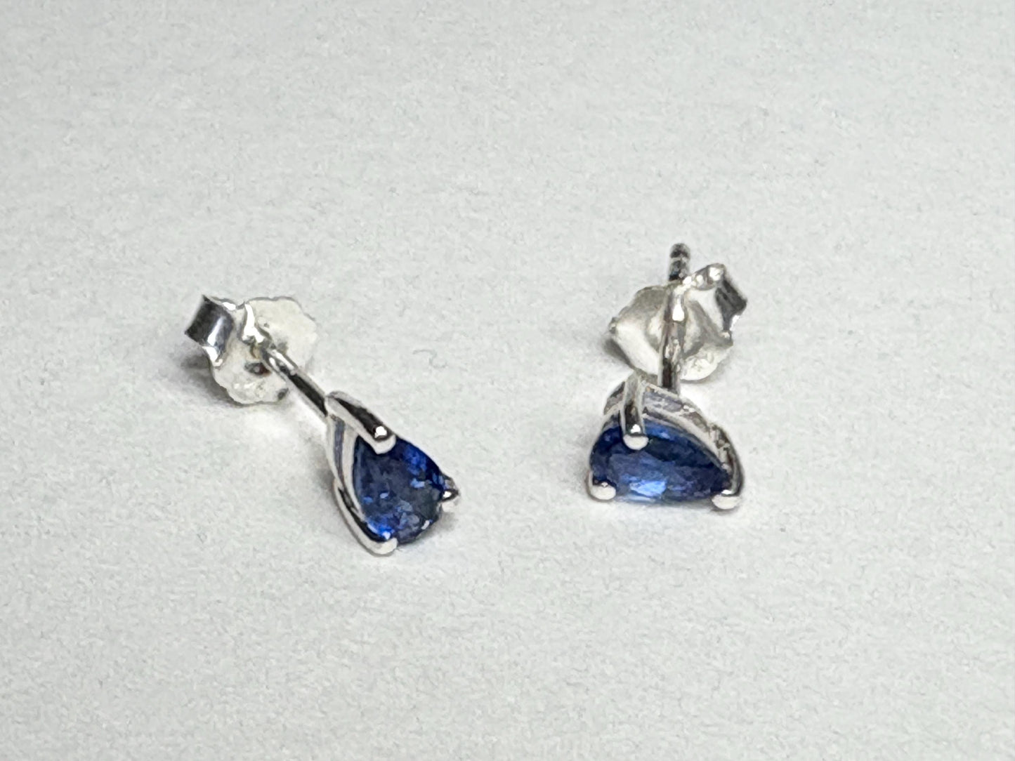 Kyanite stud earrings in pear shape, set in sterling silver.