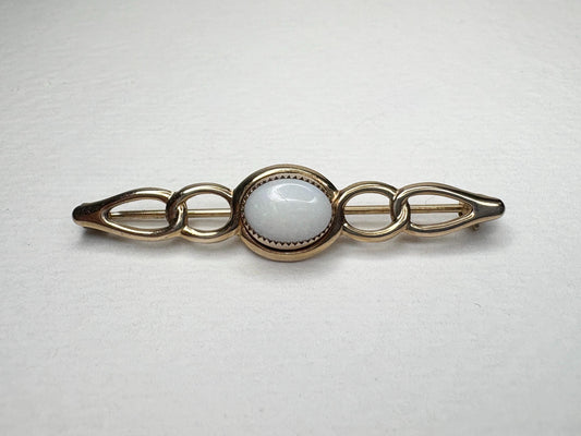 Australian white opal bar brooch in solid 14k gold.