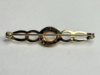 Australian white opal bar brooch in solid 14k gold.