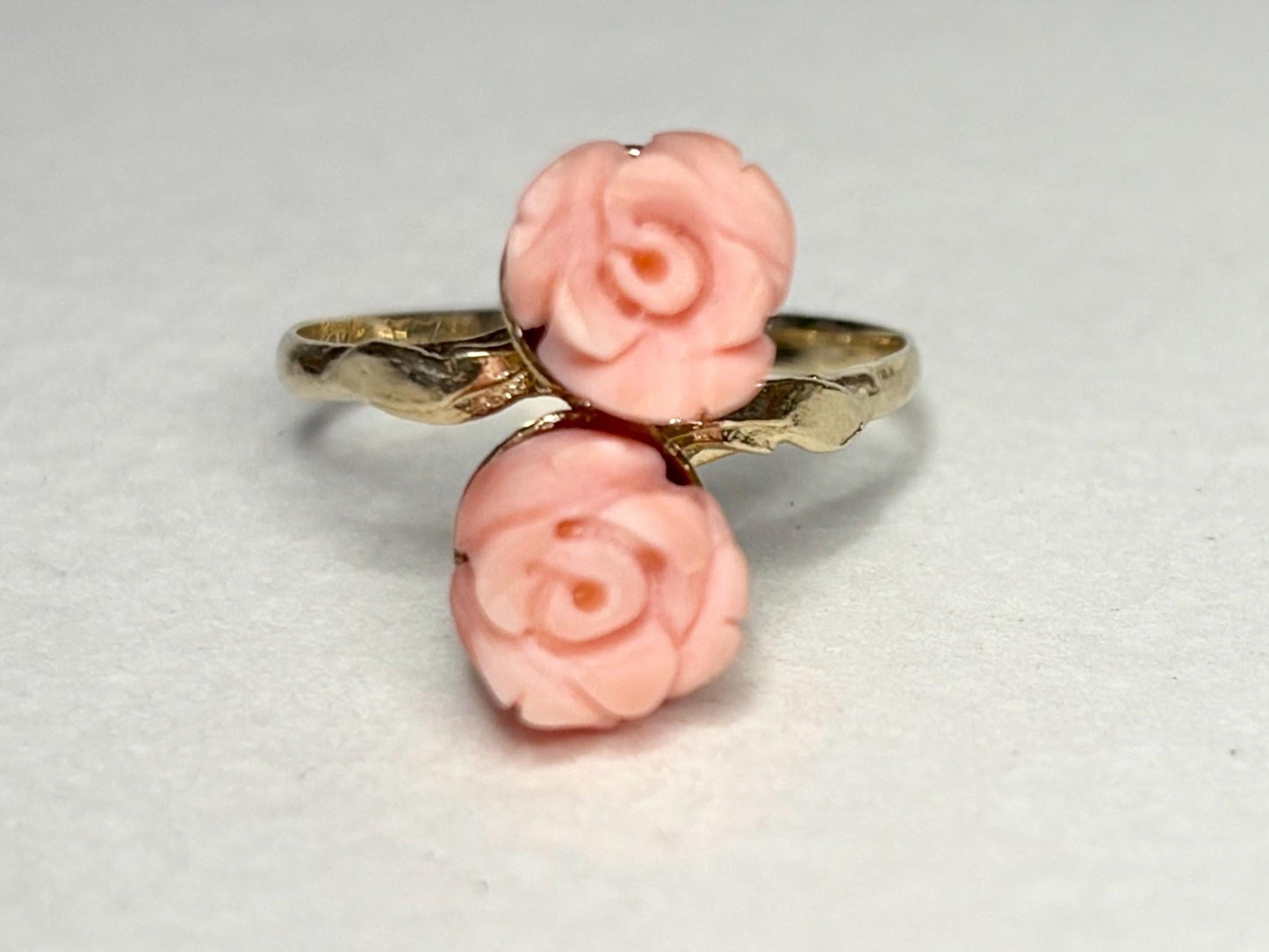 10k gold ring with two carved angel skin coral rose buds.