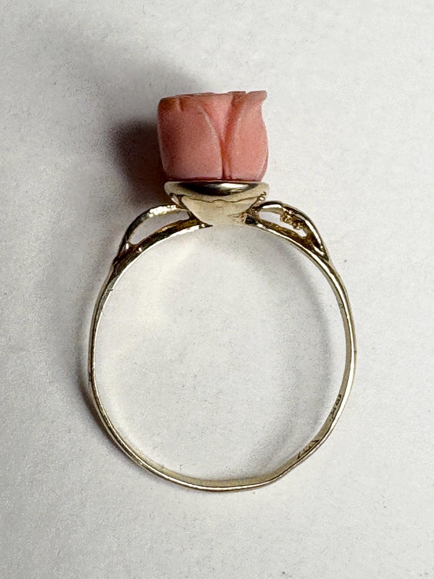 10k gold ring with a carved angel skin coral rose bud.