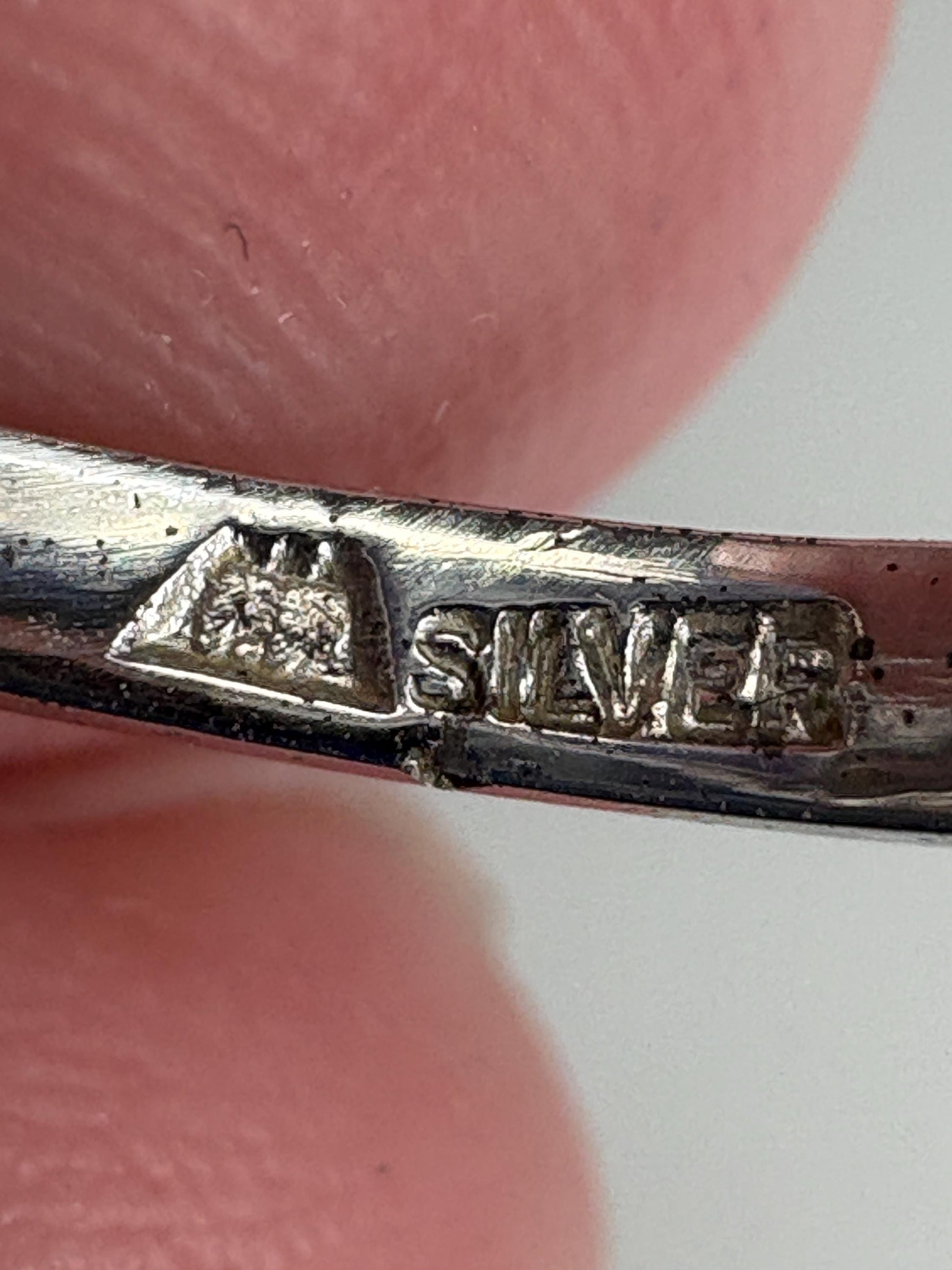 Vintage rhodium plated sterling silver ring with "SILVER" stamp.