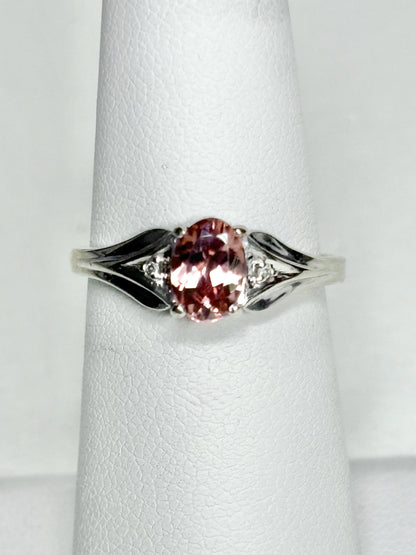 Oval blush pink zircon ring with diamond accents in 10k white gold.