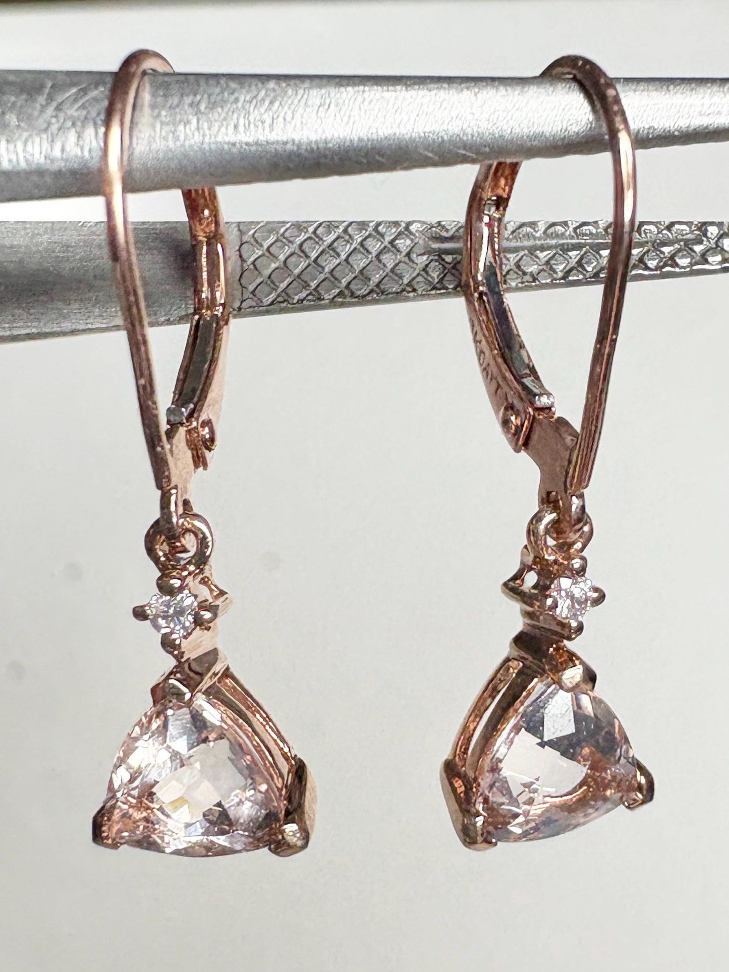 Trillion morganite and diamond dangle drop lever back earrings in 10k rose gold.