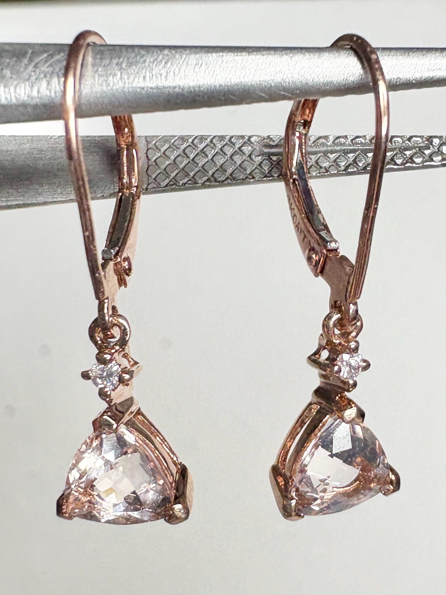 Trillion morganite and diamond dangle drop lever back earrings in 10k rose gold.